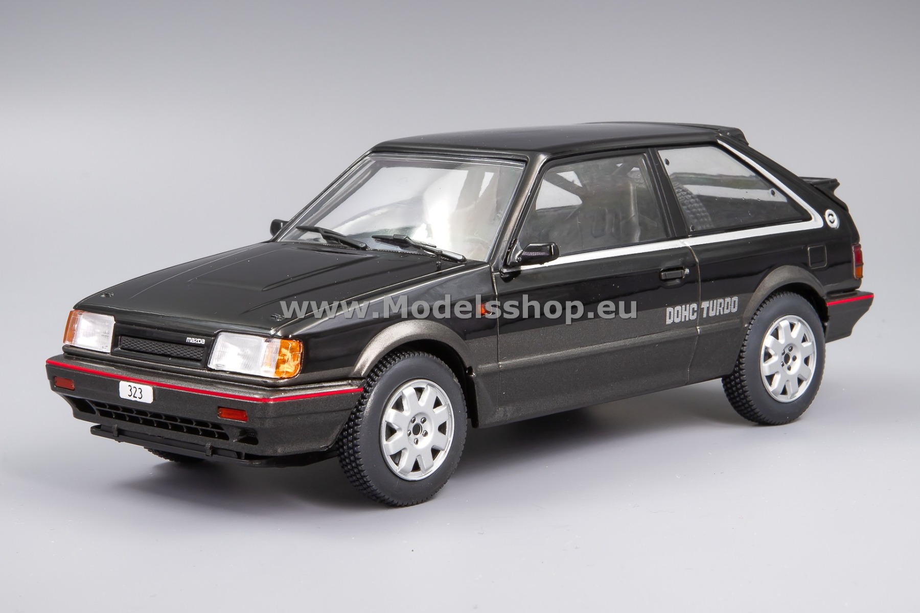 WhiteBox WB124222 Mazda 323 3d 4WD Turbo, 1989 /black - dark grey metallic/